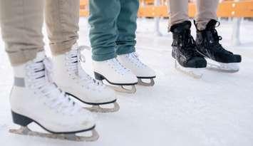 People wearing skates at an ice rink (Image courtesy of shironosov / iStock / Getty Images Plus via Getty Images)