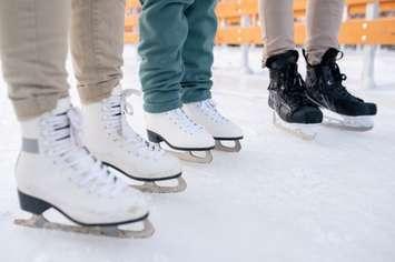 People wearing skates at an ice rink (Image courtesy of shironosov / iStock / Getty Images Plus via Getty Images)