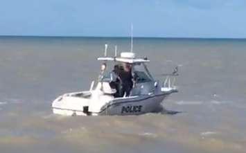 An OPP marine vessel searching for a missing 18-year-old swimmer at the main beach in Port Stanley, July 15, 2016. Photo courtesy of OPP Sgt. Dave Rektor.