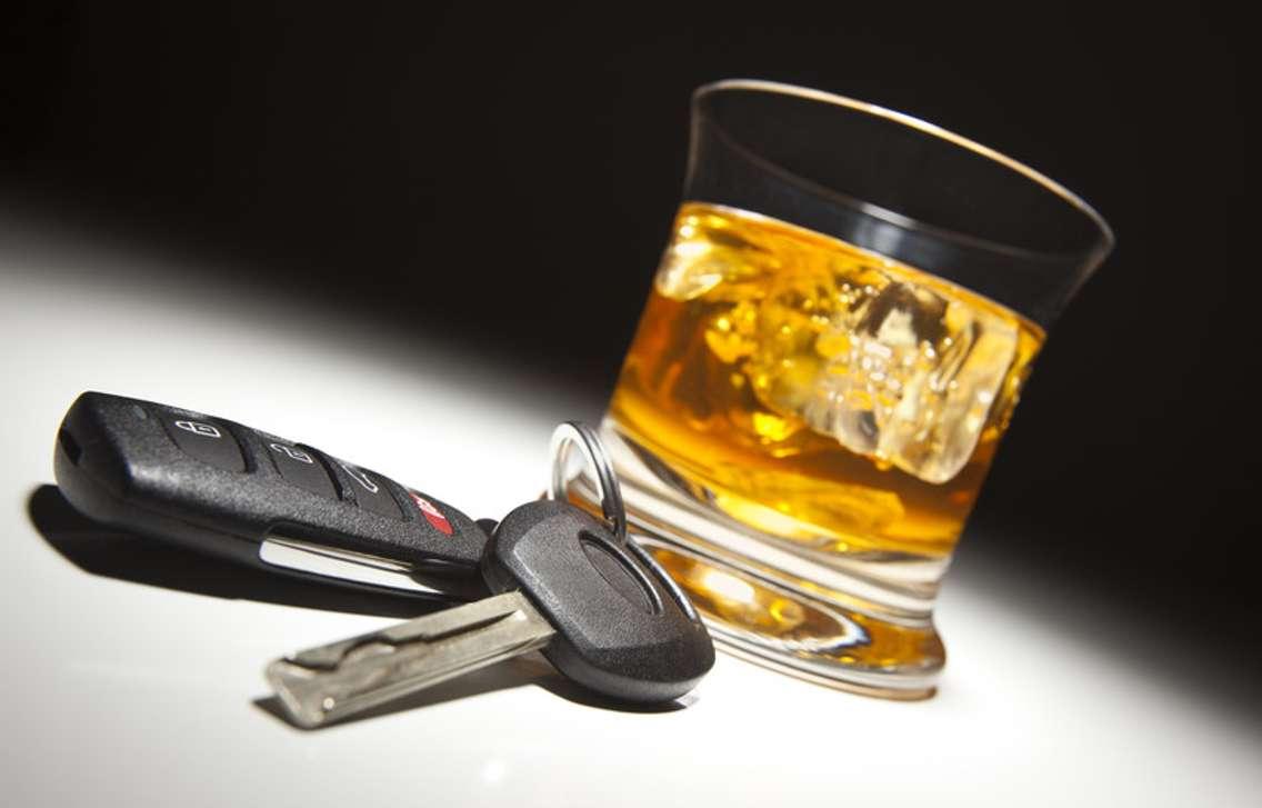 Woman asleep at wheel of running vehicle charged with impaired driving