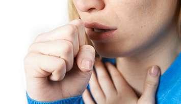 File photo of woman coughing. Photo courtesy of © Can Stock Photo / HighwayStarz