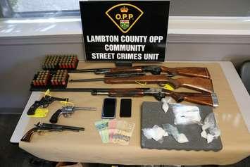 Drugs, guns and cash seized by the OPP in busts in St. Clair Township and Wallaceburg - Oct. 12/24 (Photo courtesy of OPP)