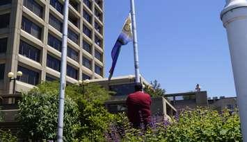 Pride flag being raised at Seaway Centre Parkette on May 31, 2024 (Photo by: Lindsay Newman/ Blackburn Media)