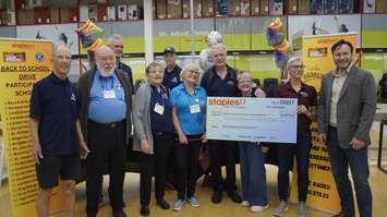 Local Kiwanis club members and Staples staff celebrating money raised for back to school. (Photo by: Lindsay Newman/ Blackburn Media)