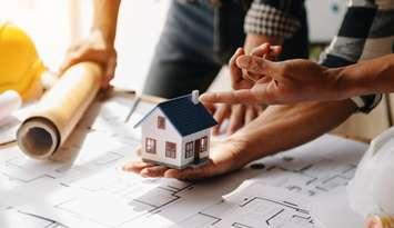 Discussion and planning of housing construction (Image by nuttapong punna / iStock / Getty Images Plus via Getty Images)