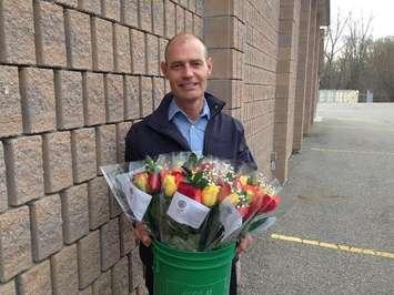 Rotarian Rob Brown prepares to deliver roses as part of the club's annual fund raising event Apr 4 2015 (Photo by Simon Crouch)
 