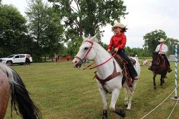  Pippa James, 10, warms up Zypher with the Off Kilter team for a performance at the Woodslee 2022 Canada Day festival. (Submitted photo)