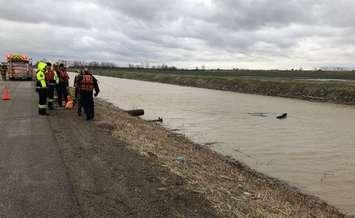 Emergency crews at the scene of a submerged vehicle in a creek just outside of Tilbury. (Photo courtesy of Chatham-Kent Fire and Emergency Services)