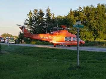 A woman is airlifted from the scene of a crash on Base Line near Thamesville, August 2, 2016. (Contributed Photo)