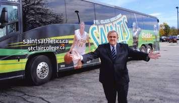 Dr. John Strasser in front of St. Clair College athletics bus (Photo by: St. Clair College)  