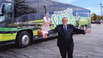 Dr. John Strasser in front of St. Clair College athletics bus (Photo by: St. Clair College)  