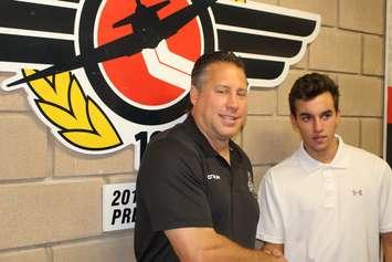 Windsor Spitfires general manager Warren Rychel welcomes new Spits forward Mathew MacDougall to the WFCU Centre on August 23, 2017. Photo by Mark Brown/Blackburn News.
