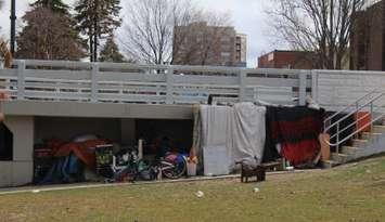 An encampment underneath the Third Street Bridge in Chatham. April 2023. (Photo by Millar Hill)