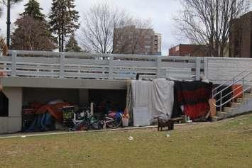 An encampment underneath the Third Street Bridge in Chatham. April 2023. (Photo by Millar Hill)