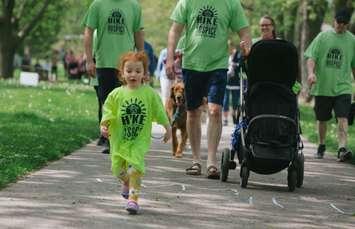 Clair skips along Mud Creek Trail in Chatham during the 8th Hike for Hospice. She was hiking in memory of her Grandpa Grant. (Image courtesy of the Chatham-Kent Hospice Foundation)