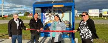 Points Plaza bus stop in Kettle Point (L to R) Lambton Shores Mayor Doug Cook, Artist Moses Lunham, Artist Bridget George, Kettle & Stony Point First Nation Chief Kimberly Bressette (Photo courtesy of Huron Shores Area Transit)