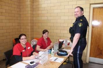 OPP Sergeant Brian Knowler getting ready to donate blood at a Uniforms Unite To Save Lives event in Chatham April 13,2016. (Photo by Simon Crouch) 