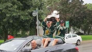 London Knights co-captains Mitchell Marner and Christian Dvorak raise the Memorial Cup during a parade through downtown London, August 25, 2016. (Photo by Miranda Chant, Blackburn News)