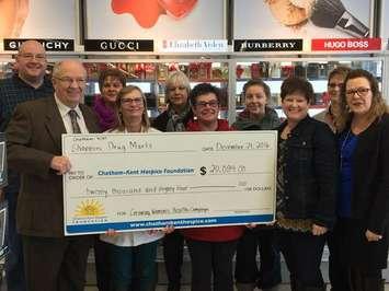 Shoppers Drug Mart presents a cheque for just over $20,000 to the Chatham-Kent Hospice Foundation.
