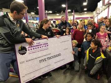 Planet Fitness in Chatham makes a $5,000 donation to Big Brothers Big Sisters during the gym's grand opening, December 2, 2019. (Photo by Allanah Wills, Blackburn News)
