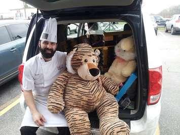 Chatham Breakfast House & Grill owner Brian Machado with the MyCK.ca van full of toys for Chatham Goodfellows. (Photo courtesy of Ron Blommers) 