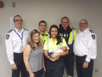 Baby meets paramedics who helped deliver him.  March 30, 2017.  (Photo courtesy of CK EMS)