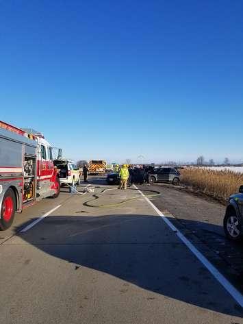 Investigators look for clues following a collision on eastbound Hwy 401 at Comber Side Road in Lakeshore, December 23, 2017. Photo provided by Ontario Provincial Police/Twitter.