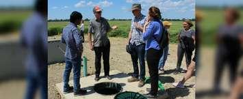 Charlie Lalonde with the The Thames River Phosphorus Reduction Collaborative, talks to a group during a demonstration at Roesch Farm in Kent Bridge on Wednesday, June 26, 2019. (Photo by Allanah Wills) 