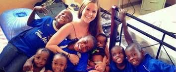 Emily Hime with Haitian children at the childrens home she operates in Haiti. (Photo courtesy of www.himeforhelp.org)