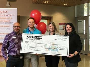 L-R: receiving a campaign lead donation of $15,000 to the 2018 YMCA Strong Kids Campaign is Chris Prince-YMCA Community Engagement Coordinator, Spencer Antaya -TekSavvy, Kathi Lomas-McGee-YMCA CEO, Amy Wadsworth-YMCA General Mgr. (Photo courtesy of Gerry Gillis)