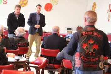 NDP Veterans Affairs critic Peter Stoffer, left, and Windsor-West MP Brian Masse speak with veterans in Windsor on December 14, 2014. (Photo by Jason Viau)
