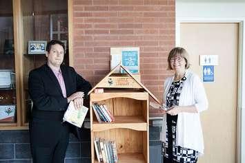 Andrew Tompsett (L) and CKHA President Lori Marshall (R) standing with CKHA's new Little Free Library. August 16, 2017. (Photo courtesy of Lori Marshall). 