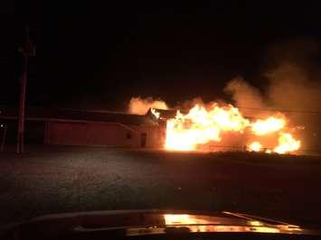 A barn burns out of control at 1400 Rd E in Leamington on October 8, 2017. Photo courtesy of Leamington Fire/Twitter.