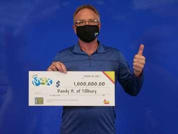 Randy Hachey of Tilbury claims his Lotto Max prize (Photo courtesy OLG) 