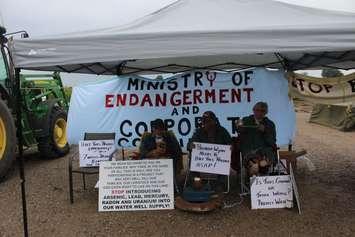 WWF protesters chained to tractor weight on Bush Line in Dover Centre. August 29, 2017. (Photo by Sarah Cowan Blackburn News)  