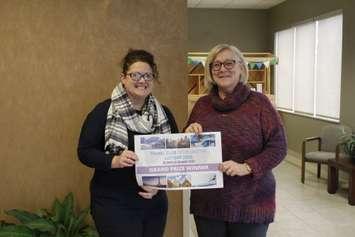 Aline Middleton, the grand prize winner of the Travel Club Dream Vacation, is congratulated by Deborah Hook, the executive director of Community Living Wallaceburg. (Photo courtesy of Community Living Wallaceburg)