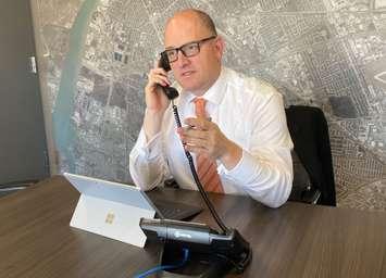 Windsor Mayor Drew Dilkens on the phone. (Photo courtesy of Drew Dilkens)