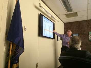 The Chatham-Kent Public Utilities Commission General Manager Tom Kissner points to a chart during a presentation at a meeting on February 12, 2015 in Chatham. (Photo by Ricardo Veneza)