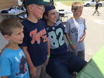 LaSalle native and Super Bowl Champion Luke Willson poses for photos and signs autographs at a community event in his honour held at the Vollmer Recreational Complex on July 5, 2014. (Photo by Ricardo Veneza)
