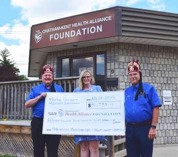 Treasurer Noble Robert Rossi (left) and Potentate Illustrious Sir Randy MacNevin (right) of Mocha Shriners present a donation of $51,738.11 to Mary Lou Crowley (centre), President & CEO of Chatham-
Kent Health Alliance Foundation. (submitted photo)