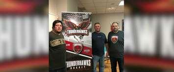 From left: Louie Blackbird, Ken Shine and Daryl Lucio unveil the Thunderhawks logo. (Photo sourced from the Wallaceburg Thunderhawks via Instagram)