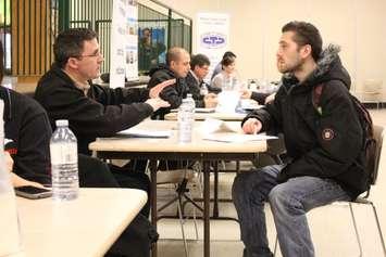  Students discuss career possibilities at a job fair. Blackburn Media file photo by Mike Vlasveld.
