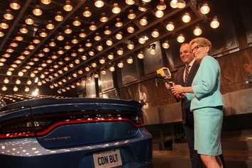 Ontario Premier Kathleen Wynne is told about vehicle testing to simulate extreme heat and cold at the Chrysler Research Centre, June 15, 2016. (Photo by Jason Viau)