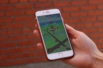 User playing the Pokemon GO app. (Photo by Jason Viau)