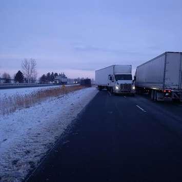Hwy. 401 was temporarily shut down for removal of a tractor trailer that ended up in a ditch near Harwich Road, Wednesday. (Photo courtesy of the OPP)