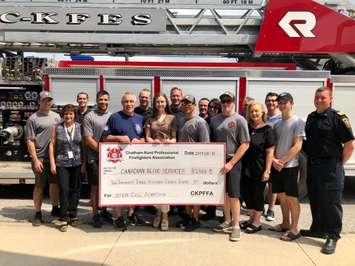 Chatham-Kent Professional Firefighters make a donation to the Canadian Blood Services on August 13, 2019. (Photo by Allanah Wills) 