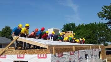 Volunteers with Habitat for Humanity Chatham-Kent help raise a portion of a wall on a house under construction in Blenheim June 10 , 2017.  Photo by Cheryl Johnstone/Blackburn News.
