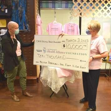 Melissa Harrigan is presented with a cheque for $10,000 by the CKHA Helping Hands Auxiliary. Photo via. the CKHA Foundation Facebook page)