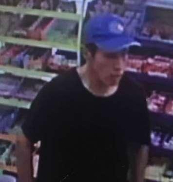 Chatham-Kent police are looking for this man after some scratch tickets were stolen from a Wallaceburg convenience store. (Photo courtesy of Chatham-Kent police)