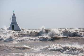 Waves crash over the pier at Erieau Beach on Lake Erie. March 8, 2017. (Photo courtesy of Cindy June via Facebook)